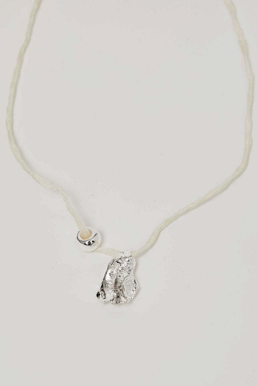Wolf Circus Maya Necklace in Silver on Cream Cord