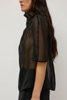 Amomento Knotted Collar Top in Black