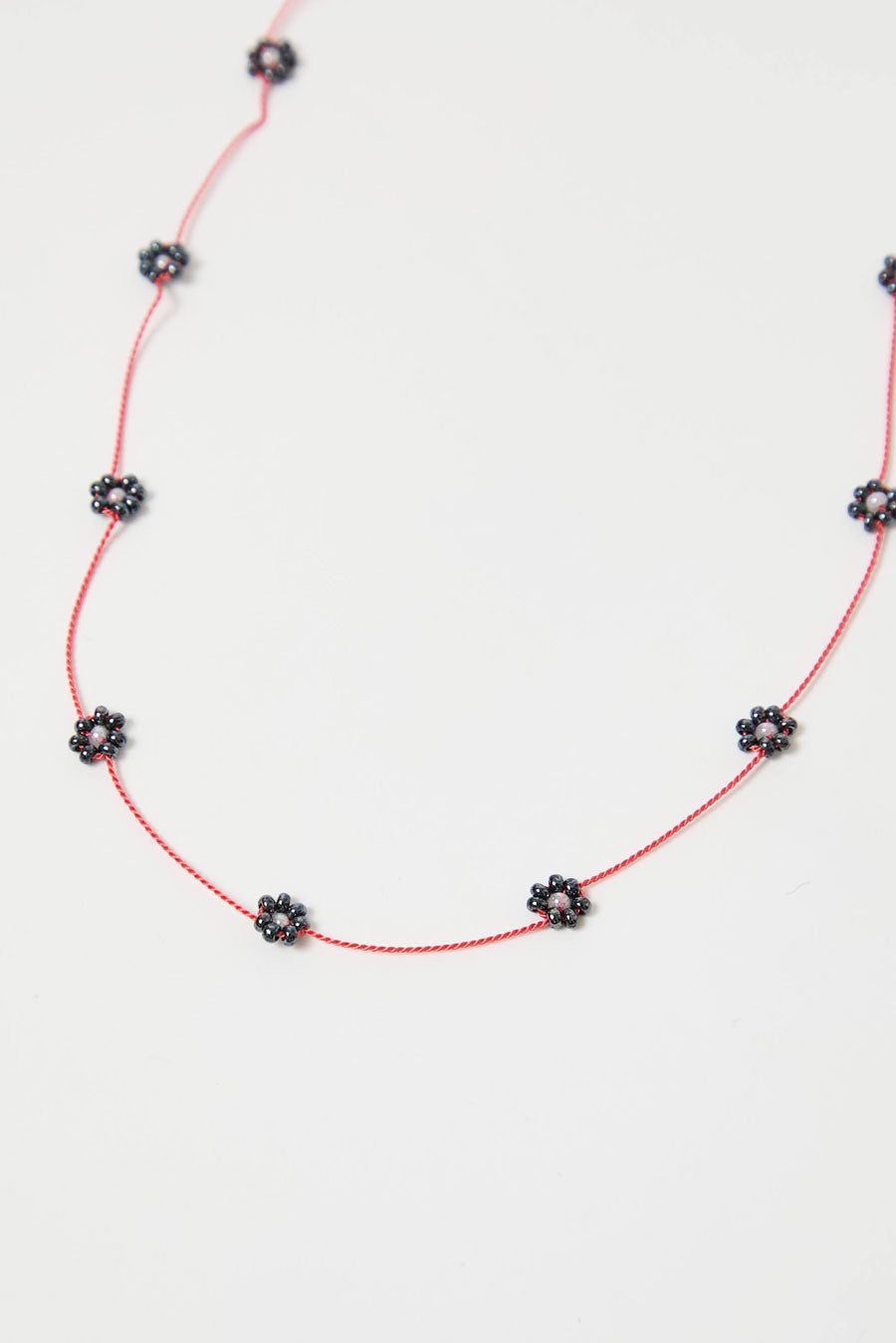 Berni Gunmetal Bloom Necklace in Metallic Beads and Coral Silk