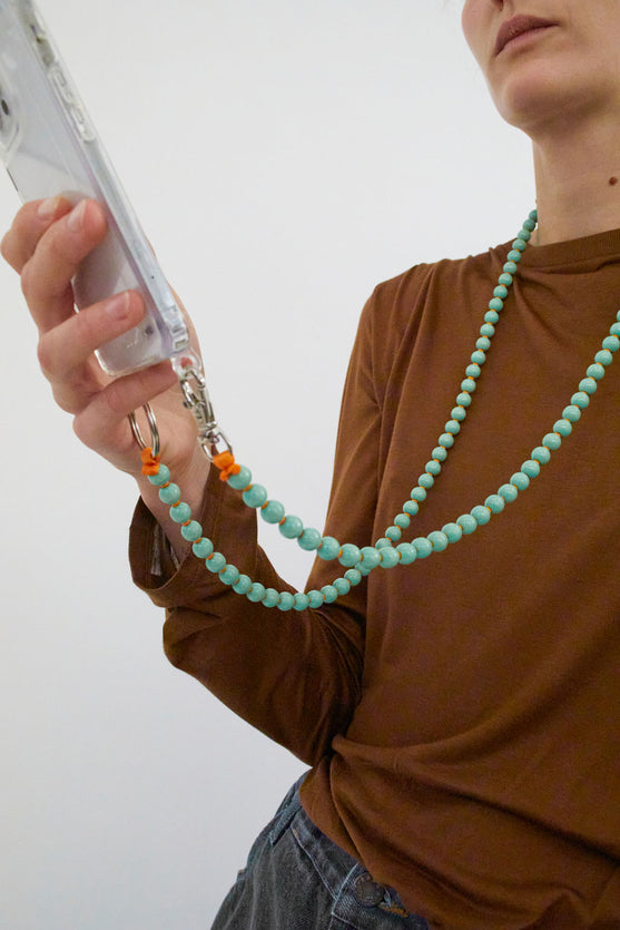 Ina Seifart Handykette Iphone Necklace in Pastel Green with Orange Thread