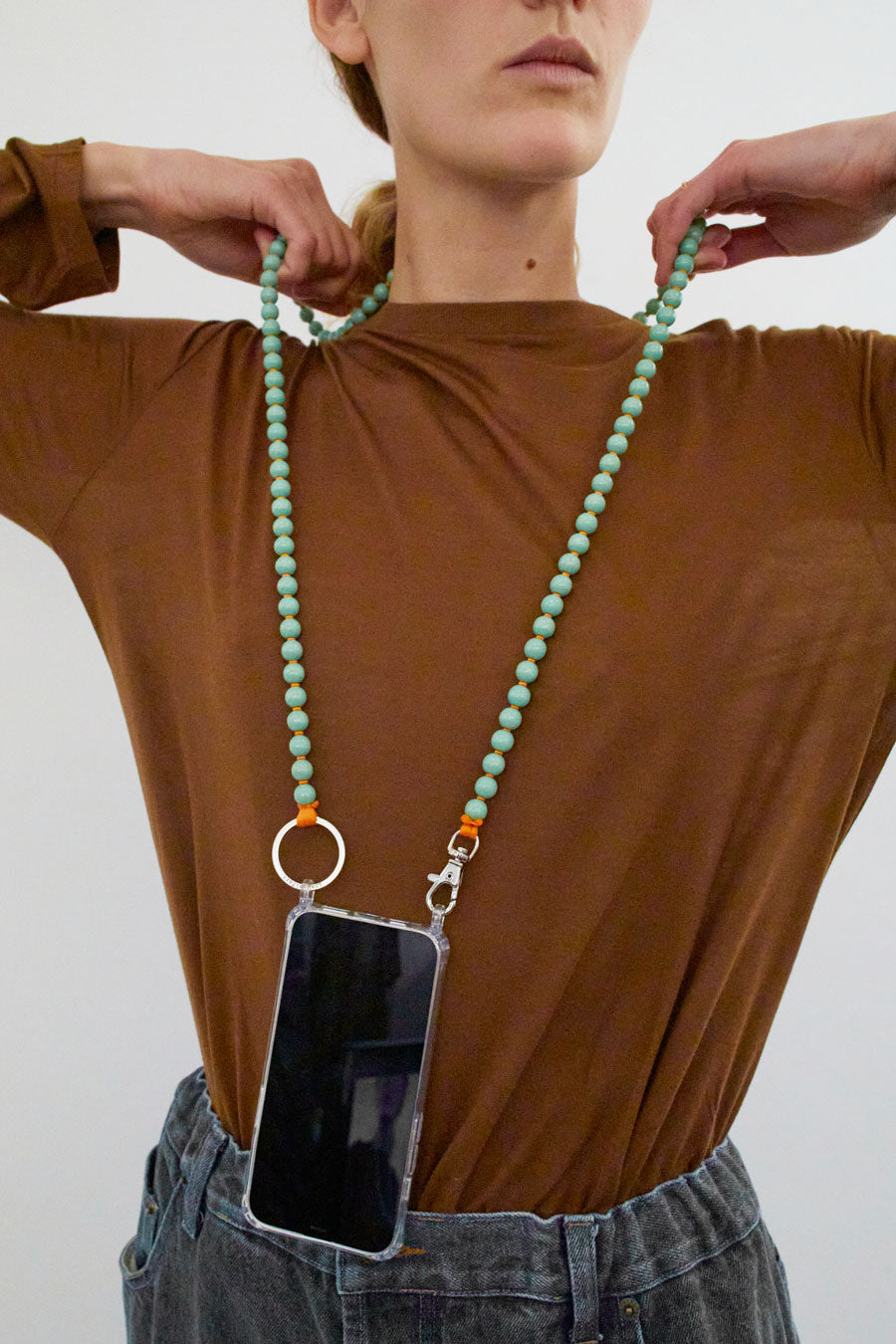 Ina Seifart Handykette Iphone Necklace in Pastel Green with Orange Thread