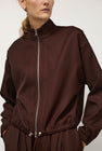 NOMIA Double Zip Top in Carob