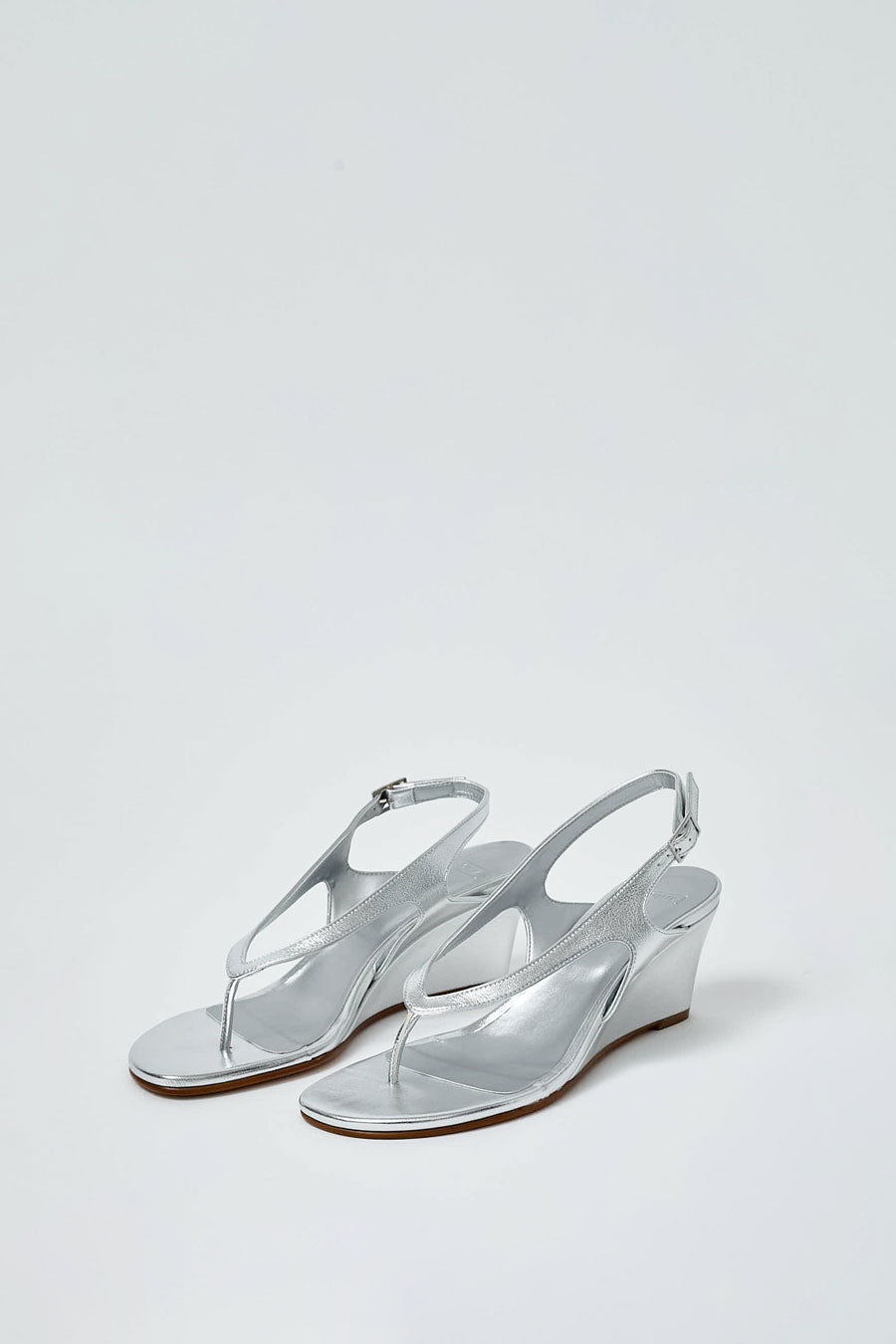 NOMIA Lela Thong Wedge in Silver