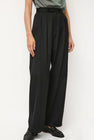 NOMIA Wide Leg Pleated Trouser in Black