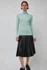 TONYWACK Faux Leather Pleated Midi Skirt in Black