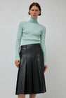TONYWACK Faux Leather Pleated Midi Skirt in Black