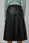 TONYWACK Faux Leather Pleated Midi Skirt in Black
