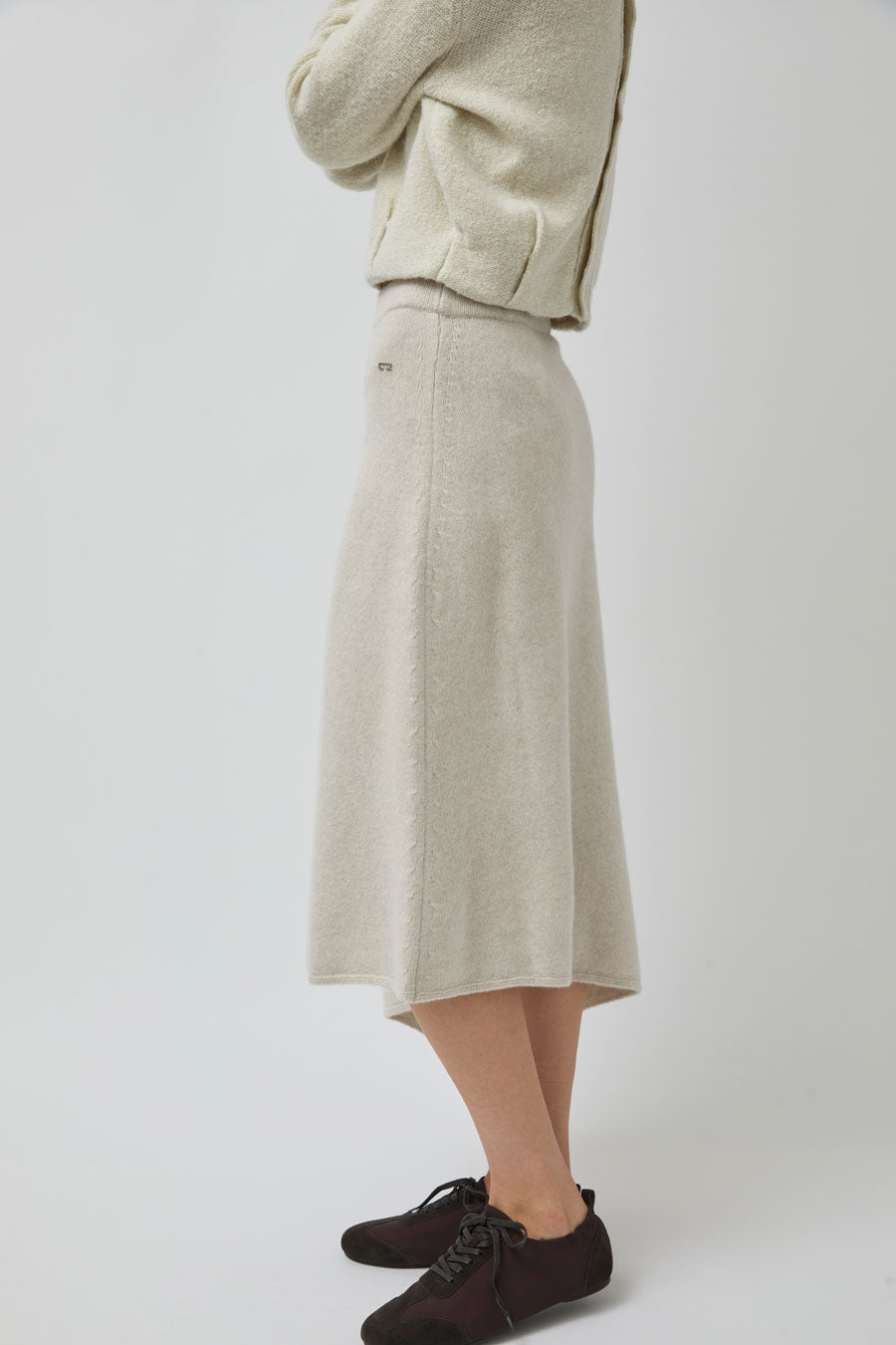 UMARMUNG Asymmetric Hem Skirt in Lamb