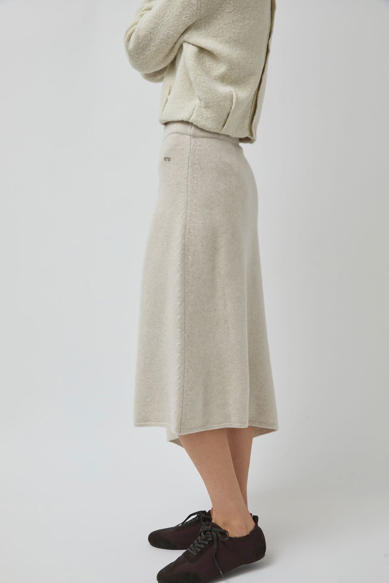 UMARMUNG Asymmetric Hem Skirt in Lamb