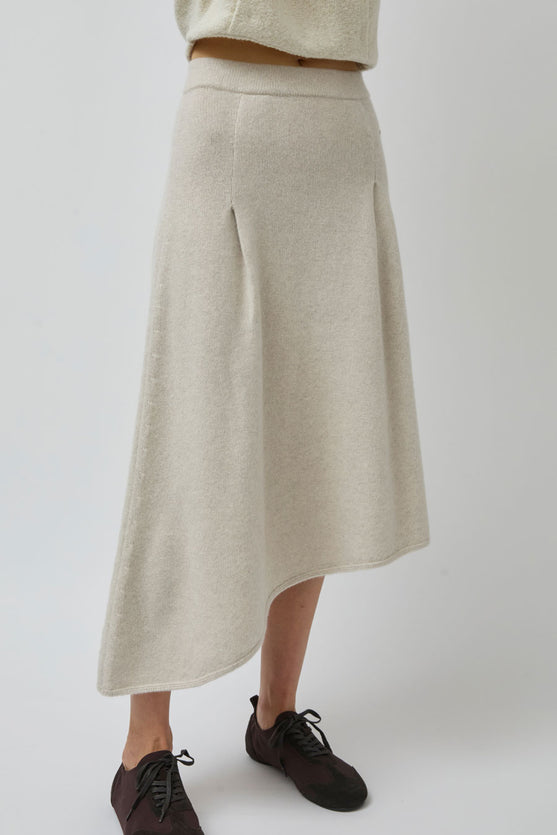 UMARMUNG Asymmetric Hem Skirt in Lamb