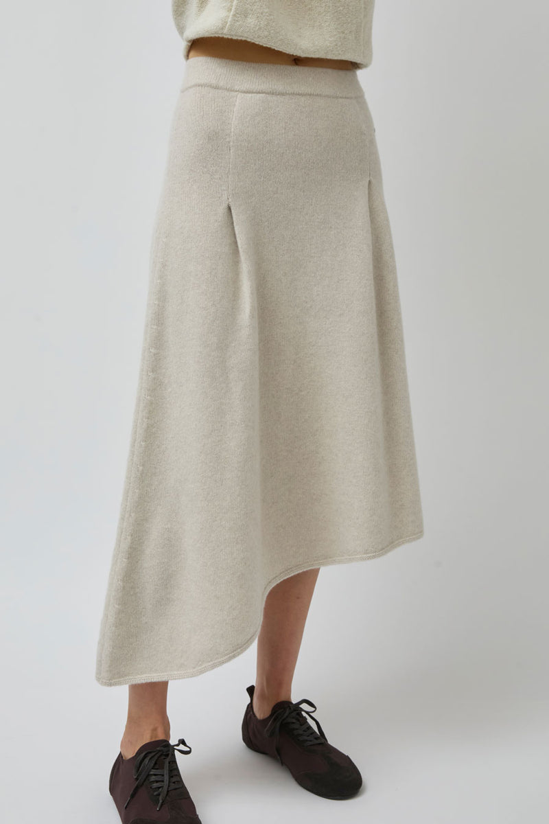 UMARMUNG Asymmetric Hem Skirt in Lamb
