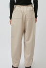 UMARMUNG Wool Flannel Oval Silhouette Pants in Cream
