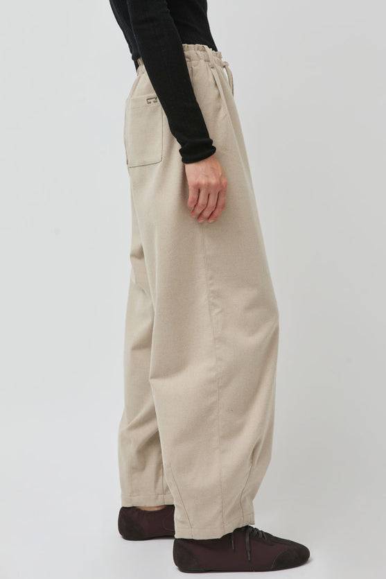 UMARMUNG Wool Flannel Oval Silhouette Pants in Cream